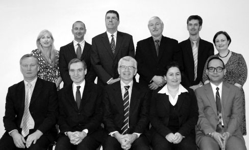 The Management Board. From left to right, standing, Senior Member Peter Murphy, Principal Member Denis O’Brien, Senior Member Irene O’Connell, acting Registrar Rhys Jones, Senior Member Giles Short, and seated, Deputy Principal Member Amanda MacDonald, acting Senior Member Kira Raif and Senior Member Linda Kirk. Acting Senior Member John Cipolla was on leave at the time the photograph was taken.